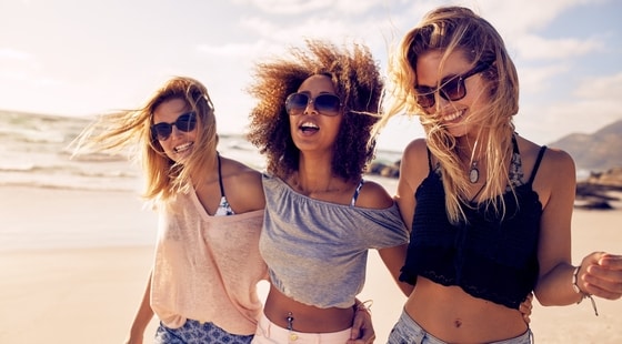 Three young women with perfect smiles